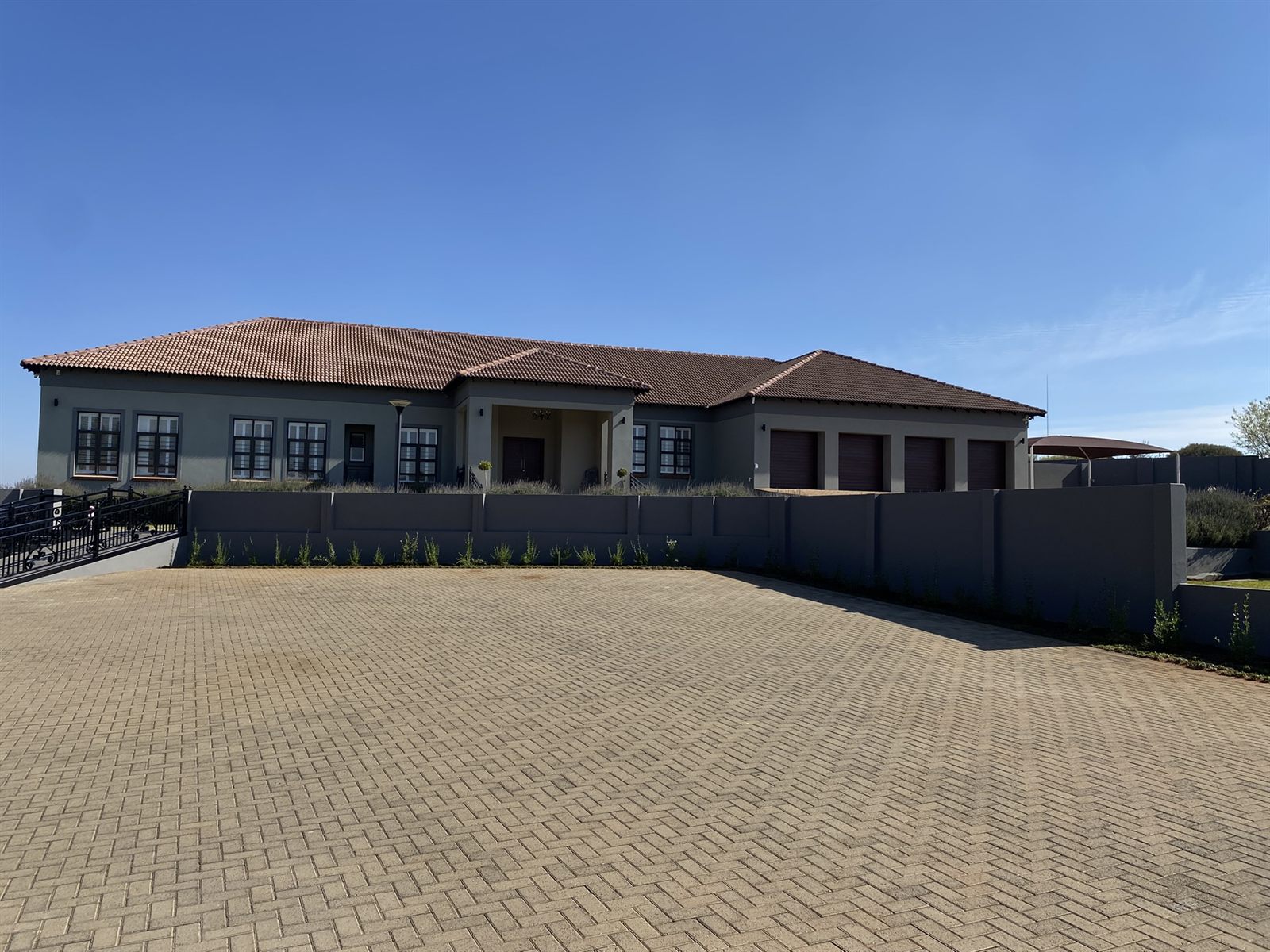 The Villa exterior and paved driveway at 2nd Cozy Corner Woodland Hills
